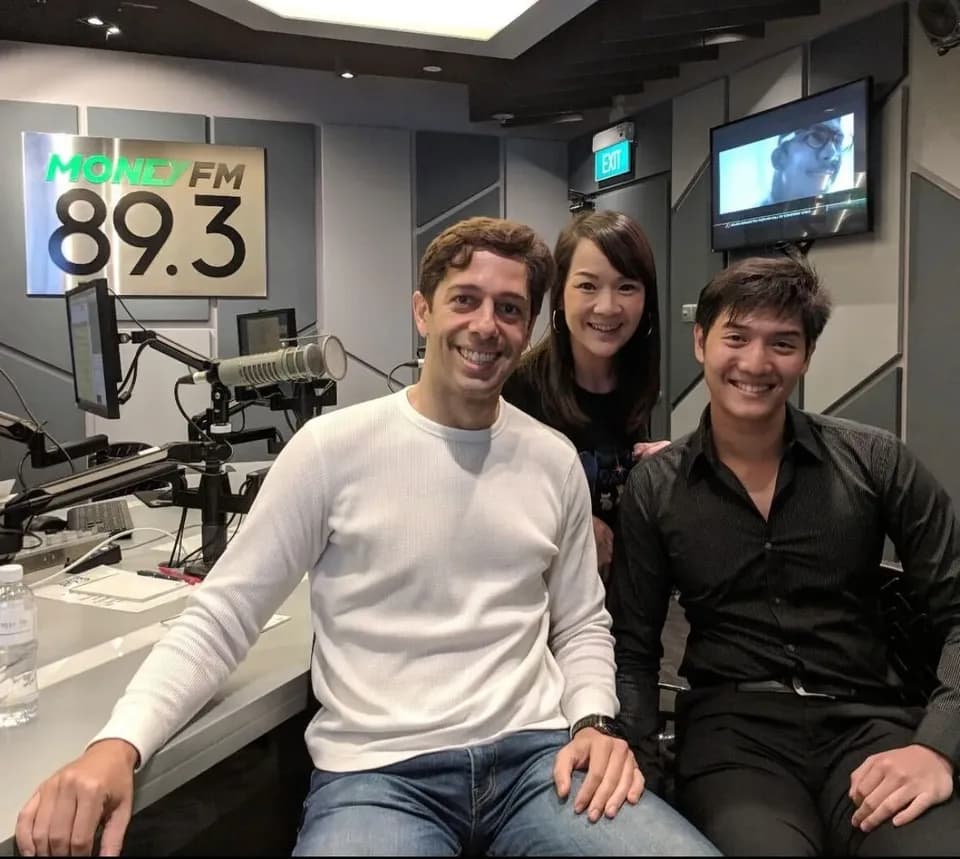 Gordon Hwa with two others in the Money FM 89.3 radio studio